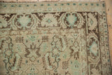 Worn Herati motif detail on Vintage Distressed Shiraz rug, sea foam green, brown.