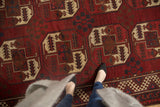 Vintage Ersari rug, cherry red field, ivory elephant footprint gul medallions, mostly even wear.