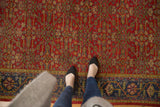 Overhead view of vintage Mahal carpet with rich brick red Herati field and navy floral border.