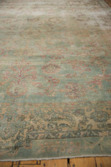 Distressed pile of the vintage Yazd carpet, revealing sea foam green field, blush palmettes, and foundation wear.