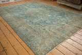 Vintage distressed Tabriz carpet with intricate sky blue vinery and textured antique ivory field.