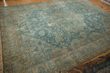 Distressed blue and ivory Tabriz rug, with scrolling vinery and chocolate brown border details.