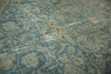 Distressed vintage Tabriz carpet in sky blue, ivory, brown hues, with mostly even wear.