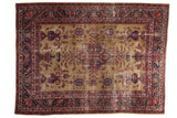 Vintage hand knotted Persian Sarouk carpet: gold field, central medallion, germinating paisley.