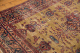 Vintage Sarouk: navy inscription cartouche, germinating paisley, and mostly even pile wear.