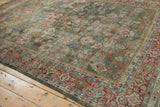 Distressed celadon green Mahal field, brick red and blue border design.