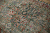 Worn texture of a vintage distressed Mahal carpet, green field, with palmettes and vinery.
