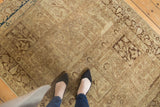 Vintage Tabriz rug corner detailing Gardens of Paradise panels, worn beige and brown hues, blue border.