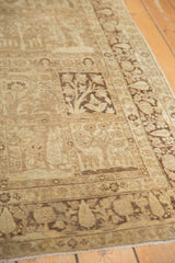 Vintage Tabriz rug's ivory and brown panels showing Gardens of Paradise with trees and deer.