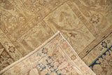 Vintage Tabriz rug's folded corner, showing hand-knotted foundation and dark floral border.