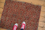 Vintage Persian Mahal rug featuring allover Herati motif in cherry red, dusty blue, and ivory.