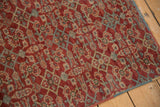 Vintage Mahal rug: cherry red, dusty blue Herati motif, even wear, polychrome selvage.