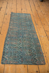 Worn pile and texture of a vintage Malayer runner with ocean blue and red boteh.