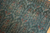 Distressed texture and aged deep blue and cherry red boteh pattern on Malayer rug.