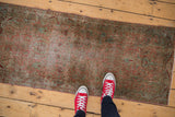 Distressed vintage Persian Yazd runner, faded blush and aqua floral European styling.