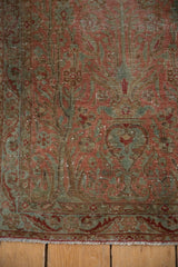 Worn pile of the vintage Yazd runner, showcasing faded European floral patterns and fringe.