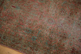 Distressed vintage Yazd rug with faded European floral vines and dusty rose, aqua tones.