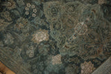 Aged aqua teal Kashan rug pile with softened floral patterns and foundation showing.