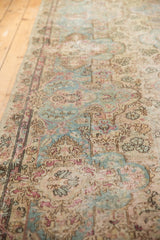 Fragment Kerman runner's distressed European and Persian floral pattern with sky blue and blush tones.