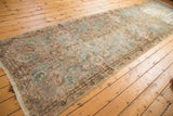 Worn vintage Kerman runner with sky blue, blush, and antique ivory Rococo motifs.