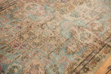 Distressed Kerman fragment's professional seam, worn pile, and Rococo florals in sky blue.
