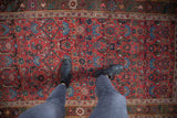 Antique Kurdish Bijar rug: cherry red allover floral pattern with sky blue and mallard green motifs.