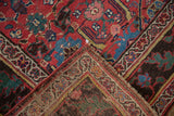 Antique Kurdish Bijar rug's folded corner revealing cherry red floral pile and woven reverse.