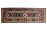 Antique Persian Kerman runner, single column medallions, intricate design, navy blue, cochineal red, bronze.