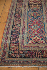 Intricate floral border, low pile, and fine weave of an antique Kerman runner.