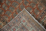 Worn pale terra cotta boteh pile and tight hand-knotted foundation of antique Tabriz runner.