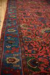 Vintage Bijar runner with indigo blue border, red motifs, and raspberry field palmettes.