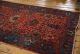 Vintage hand-knotted Bijar runner corner, indigo blue border, raspberry red field.