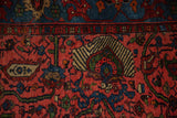 Striped palmette motif, indigo border, and raspberry red vinery on the Bijar rug.