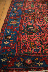 Vintage Bijar runner's raspberry red field with oversized palmettes, vinery, indigo border.