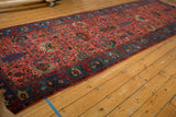 Flowing oversized palmette and vinery pattern across the raspberry red Bijar runner.