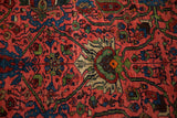 Raspberry red Bijar rug with oversized palmettes, emerald vinery, indigo, and low pile.