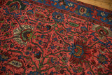 Vintage Bijar runner's raspberry red field with palmettes, indigo border, and low pile.