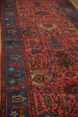 Intricate raspberry red palmettes and vinery on low pile of vintage Bijar runner with indigo border.