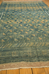 Purple plain weave and ivory fringe at the end of the distressed Belouch carpet.