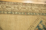 Distressed hand-knotted Persian Serab runner border, sky blue geometric motifs on sand field, even wear.
