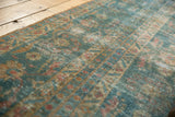 Distressed vintage Persian Mahal runner showing ocean blue green and terra cotta palette.