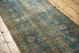 Distressed vintage Mahal runner's worn pile showing ocean blue-green, ivory, terra cotta.