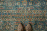 Distressed Mahal runner's worn texture, ocean blue-green, terra cotta palmette and vine patterns.