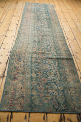 Distressed pile with ocean green, blush, wine red scrolling palmettes and vines.