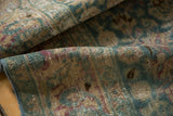 Distressed pile of vintage Meshed runner, showing knot heads, ocean green, blush, wine tones.