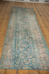 Distressed vintage Persian Meshed runner with fragmented border, ocean green, blush palmettes.