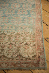 Distressed Malayer runner corner, faded boteh pattern, blush border, and worn pile.