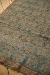 Distressed pile of vintage Malayer runner showing faded raspberry seed botehs and visible reduction seam.