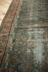 Distressed vintage Malayer runner pile showing exposed foundation, deep green, and dusty blush Herati motifs.