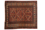 Vintage Kurdish hand-knotted carpet with a madder root red field and botanical trellis pattern, 5'5